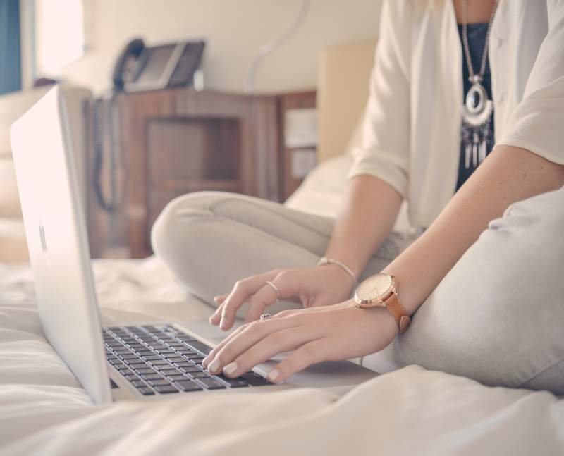 Stock image of woman typing on a laptop